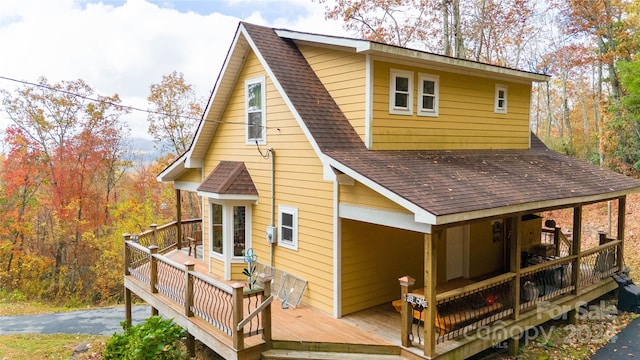 rear view of property with a deck