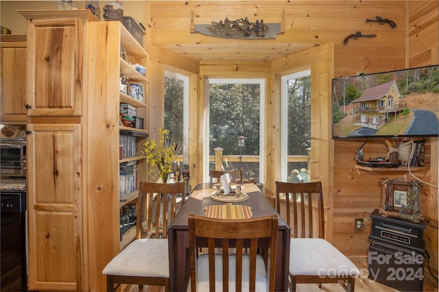 dining area with wooden walls