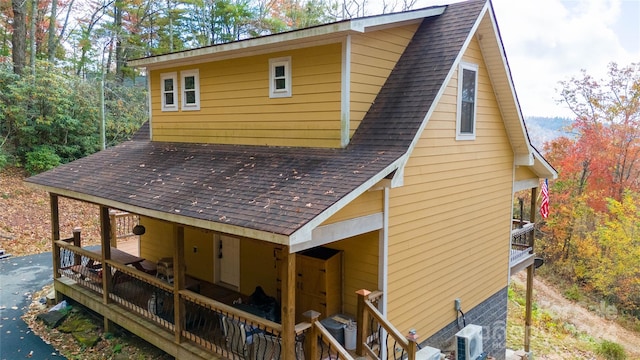 back of house with a wooden deck