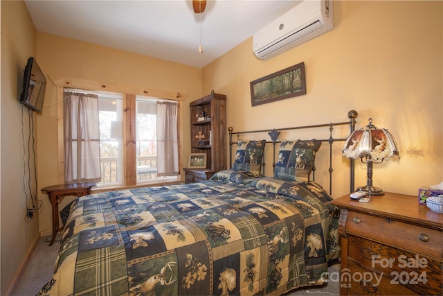 bedroom featuring carpet flooring and an AC wall unit