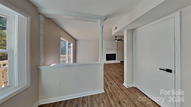 hallway with hardwood / wood-style floors