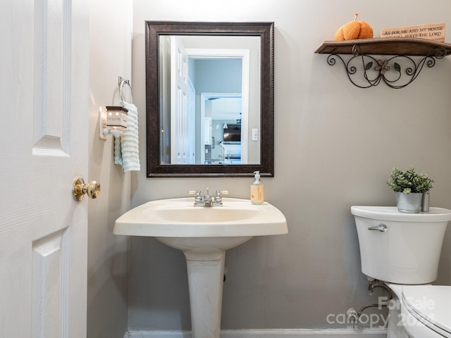 bathroom with toilet and sink