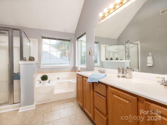 bathroom with vanity, tile patterned flooring, shower with separate bathtub, and lofted ceiling