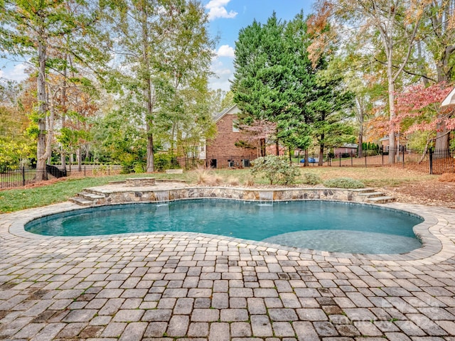 view of swimming pool featuring a patio