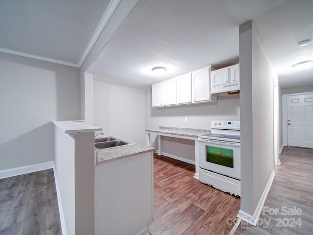 kitchen featuring light hardwood / wood-style floors, white electric range, sink, and white cabinetry