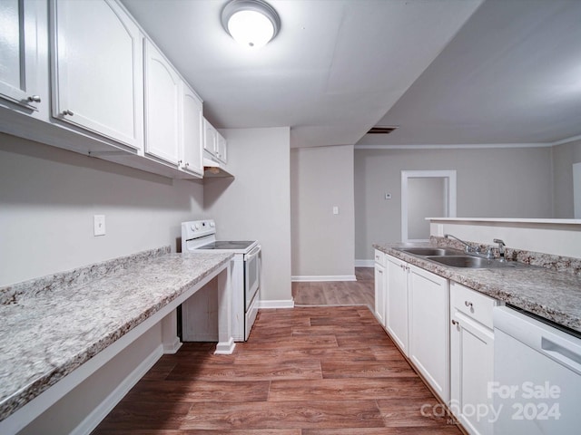 kitchen with light stone countertops, sink, hardwood / wood-style floors, white appliances, and white cabinets