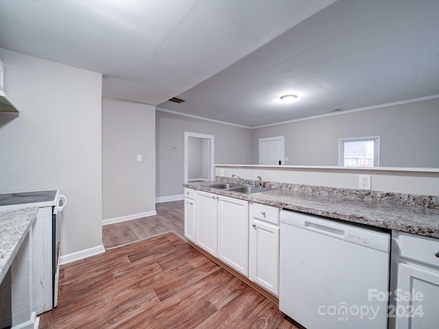 kitchen with stove, light wood-type flooring, white dishwasher, sink, and white cabinets