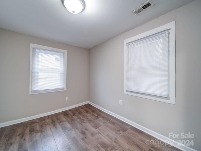 empty room featuring wood-type flooring