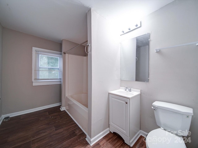 full bathroom featuring wood-type flooring, vanity, shower / bath combination, and toilet