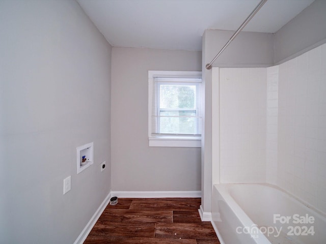 bathroom with wood-type flooring and shower / bathtub combination