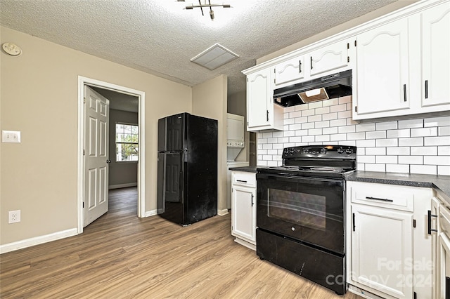 kitchen with black appliances, white cabinetry, a textured ceiling, decorative backsplash, and light hardwood / wood-style floors