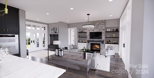 living room featuring a fireplace, french doors, and dark hardwood / wood-style flooring