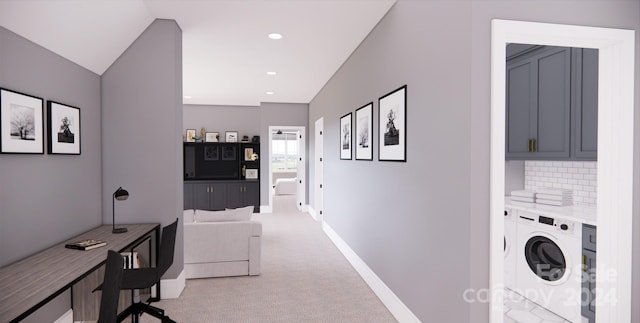 laundry area featuring light carpet