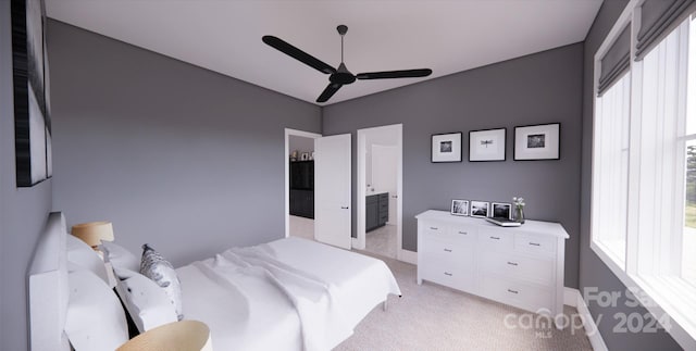 bedroom with connected bathroom, multiple windows, light colored carpet, and ceiling fan