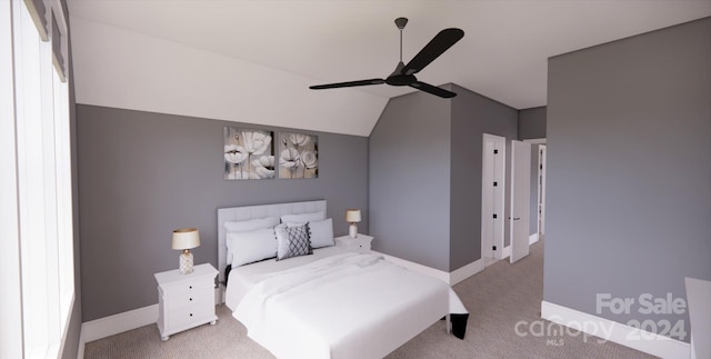 carpeted bedroom featuring vaulted ceiling and ceiling fan