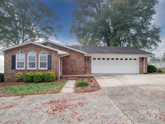 single story home with a garage