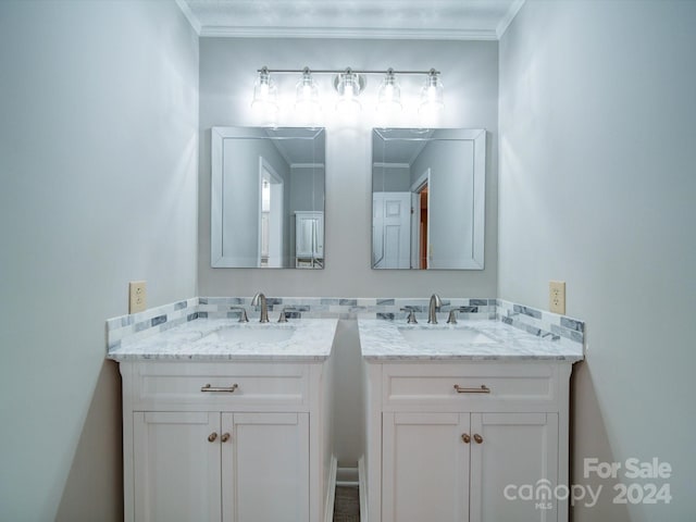 bathroom featuring vanity and crown molding