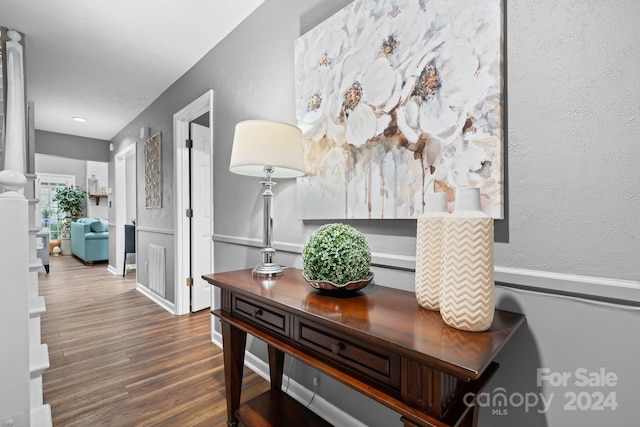 hall featuring dark wood-type flooring