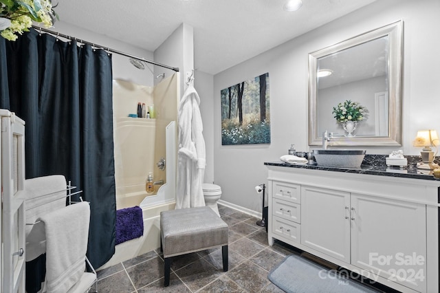 full bathroom with vanity, a textured ceiling, toilet, and shower / bathtub combination with curtain