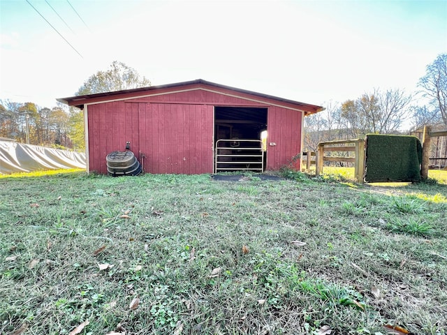 view of outbuilding featuring a yard