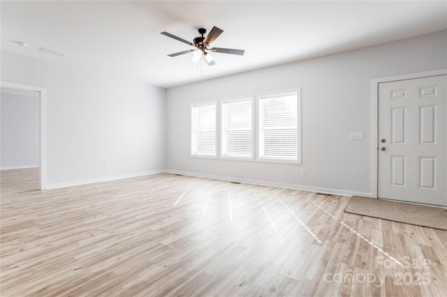 unfurnished living room featuring ceiling fan and light wood-type flooring