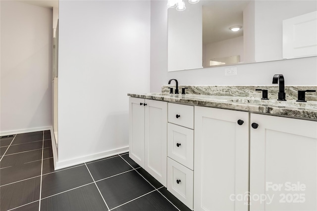 bathroom with tile patterned flooring and vanity