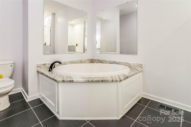 bathroom with tile patterned floors and toilet