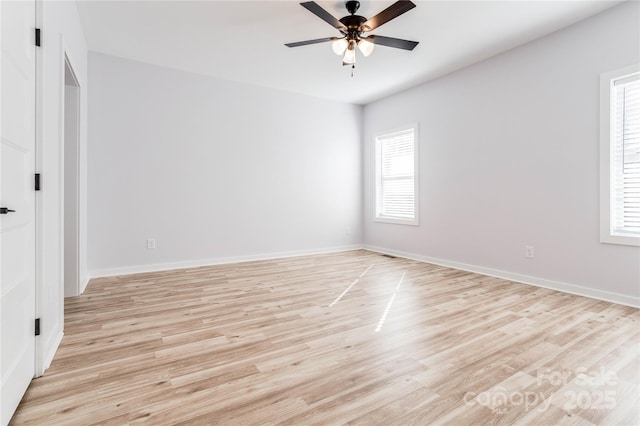 spare room featuring light hardwood / wood-style flooring and ceiling fan