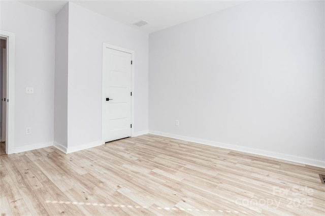 unfurnished room with light hardwood / wood-style flooring