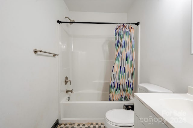 full bathroom with vanity, shower / bath combination with curtain, and toilet