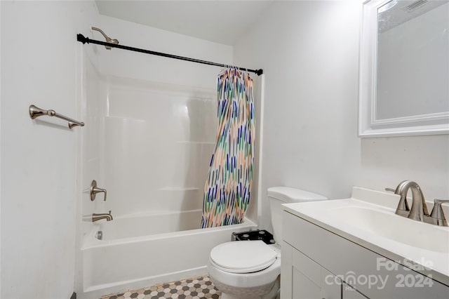 full bathroom featuring toilet, shower / bath combination with curtain, and vanity