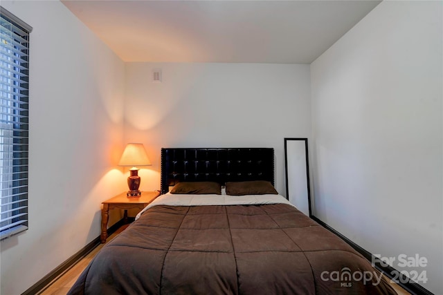 bedroom featuring hardwood / wood-style flooring