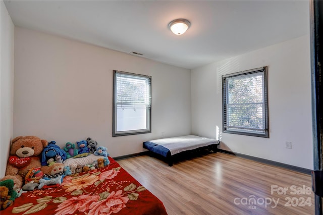 bedroom with light hardwood / wood-style flooring