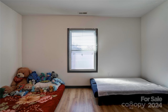 bedroom with light hardwood / wood-style floors