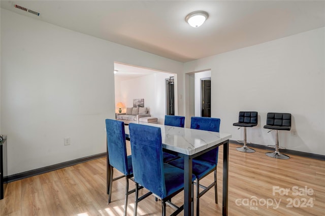 dining room featuring light hardwood / wood-style flooring