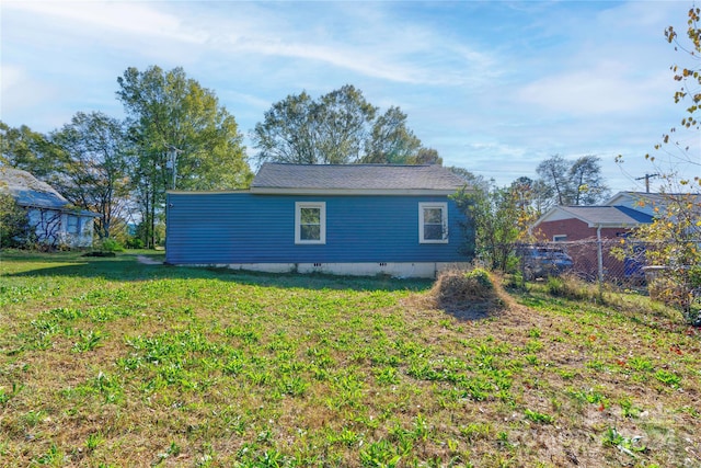 view of home's exterior with a yard