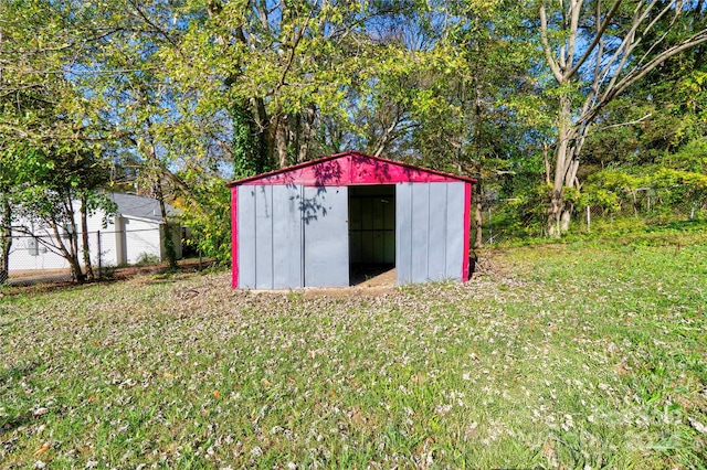 view of outbuilding with a lawn