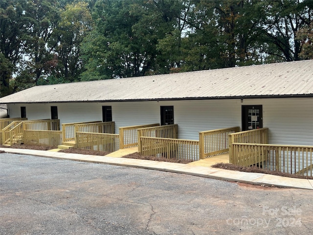 ranch-style house with a wooden deck