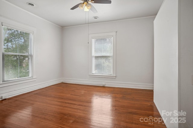 unfurnished room featuring crown molding, ceiling fan, and dark hardwood / wood-style flooring