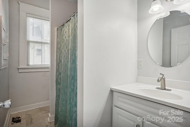 bathroom with vanity and a shower with shower curtain