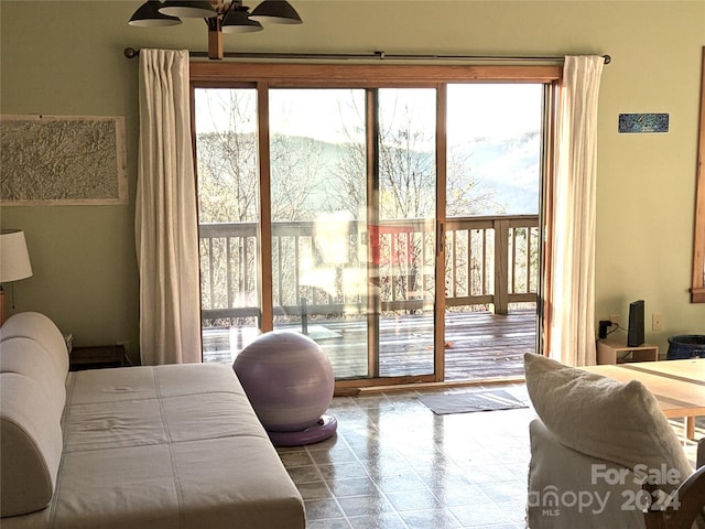 bedroom featuring access to exterior and ceiling fan