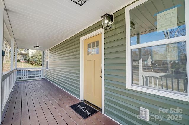 wooden deck featuring covered porch