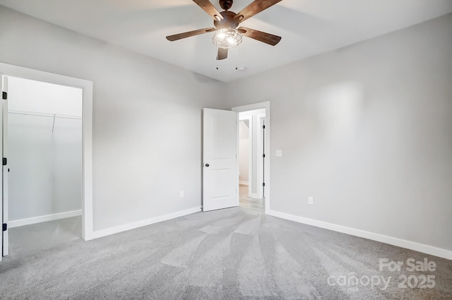 unfurnished bedroom featuring ceiling fan, carpet flooring, and a closet