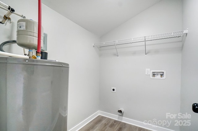 washroom with washer hookup, hardwood / wood-style floors, water heater, and hookup for an electric dryer