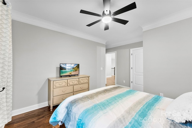 bedroom with ceiling fan, dark hardwood / wood-style floors, and ornamental molding