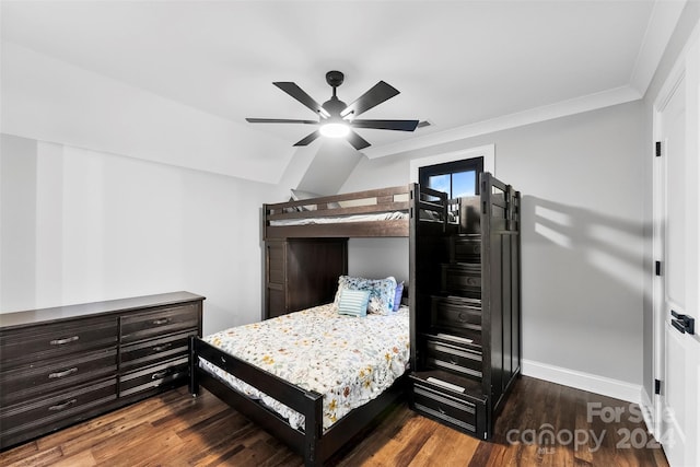 bedroom featuring dark hardwood / wood-style floors, ceiling fan, and crown molding