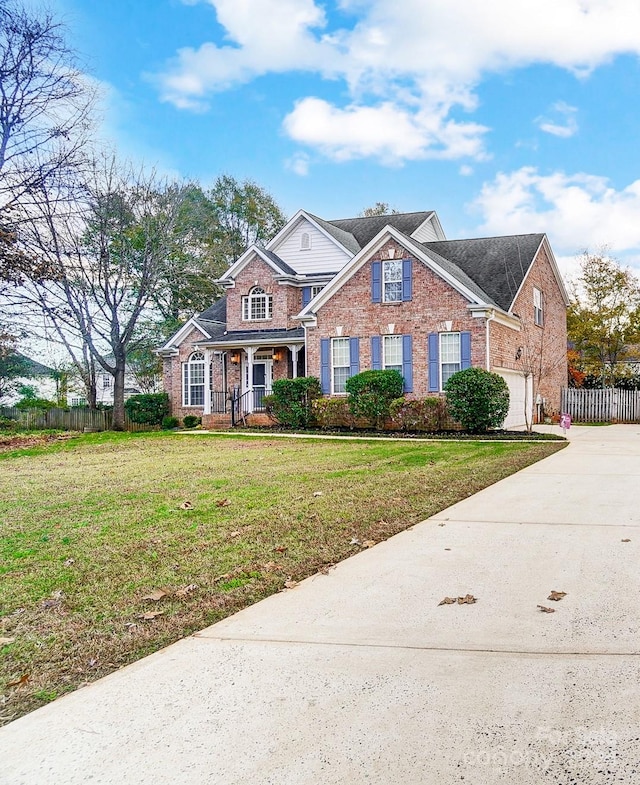 view of front of house featuring a front yard and a garage