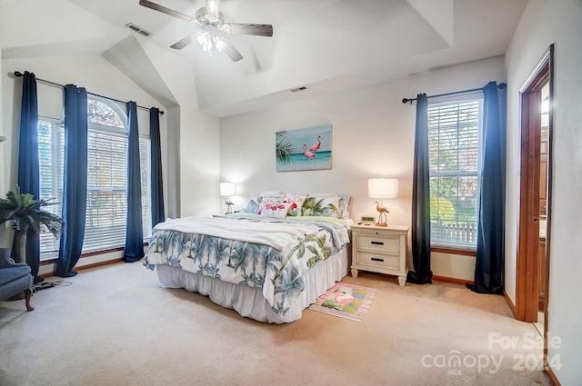 bedroom with ceiling fan, light colored carpet, and lofted ceiling