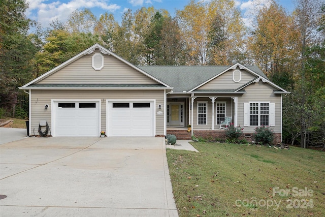 ranch-style home featuring a garage and a front yard