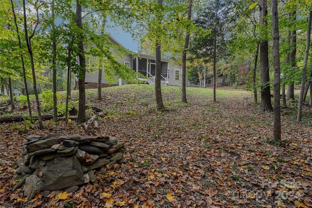 view of yard featuring a sunroom